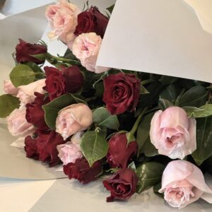 Rosy Cheeks A mix of 10 Medium Stem Pink Roses and 10 Med Stem Red Roses Foliage Signature wrap $166