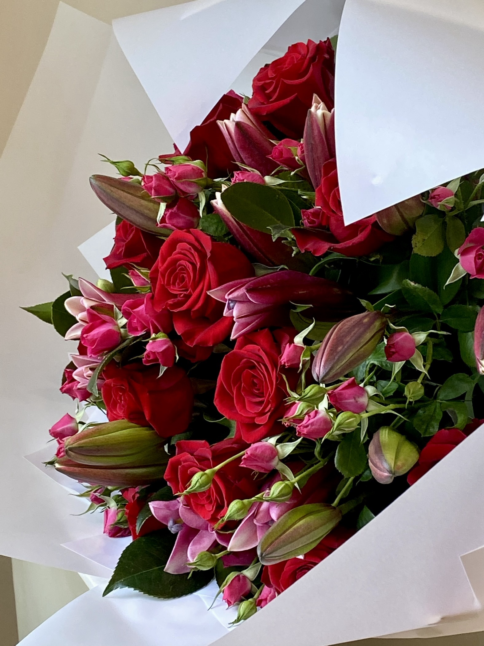 Roses, Spray roses and Lilies with Foliage $300