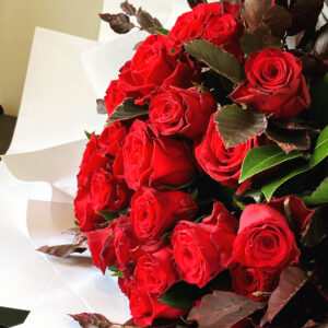 24 Long Stem Roses with Foliage $385